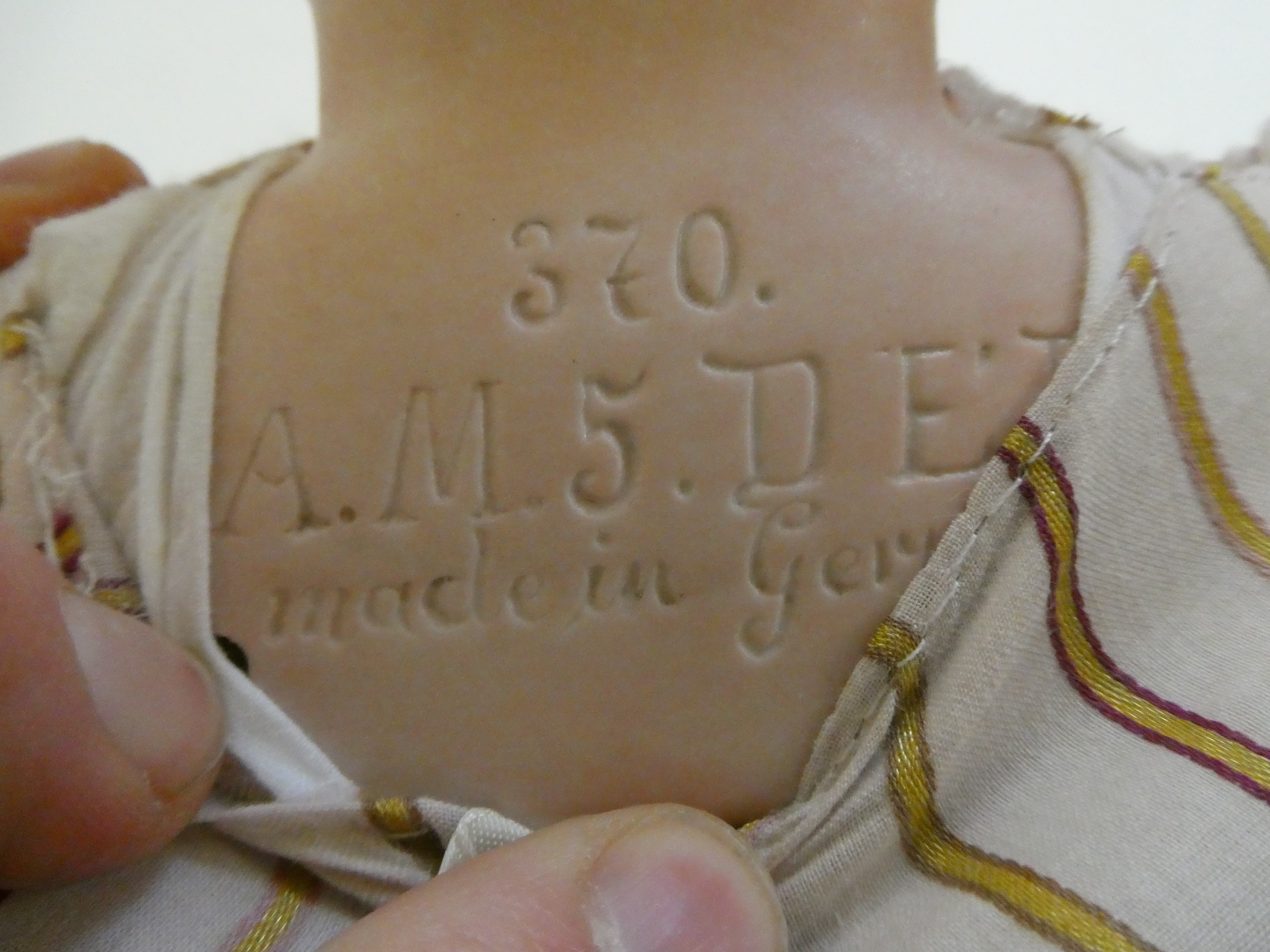 An Armand Marseille bisque shoulder head doll Image