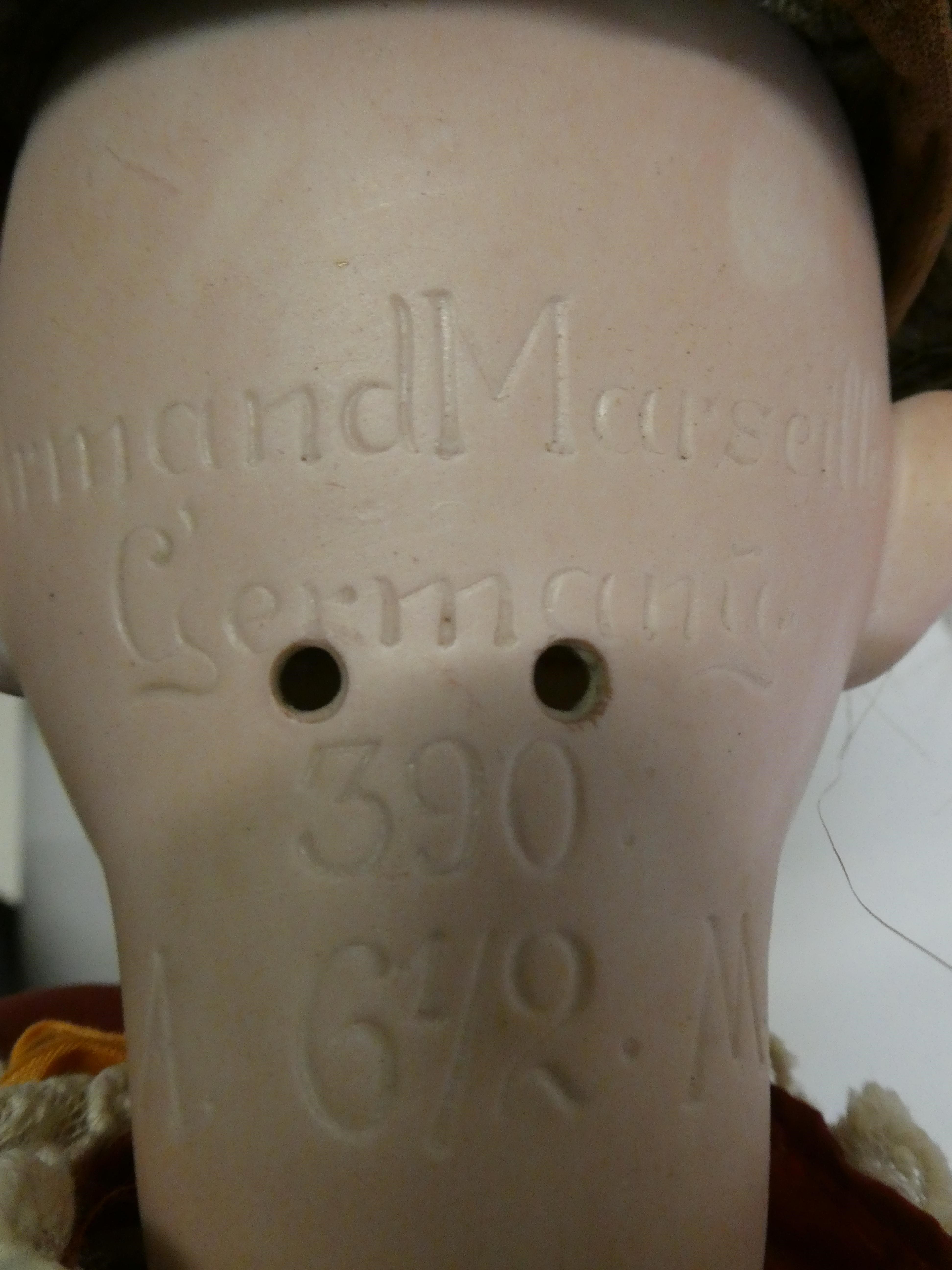 An Armand Marseille bisque socket head "mamma" doll Image