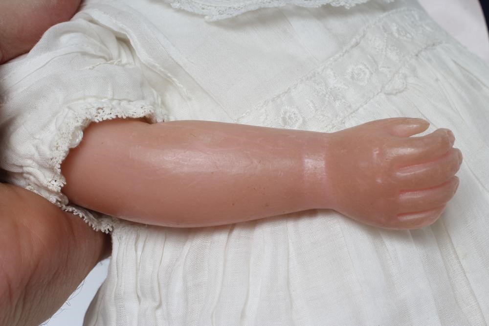 An antique wax shoulder head doll Image