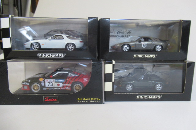 Three Minichamps Porsche limited edition model cars and a Saico Porsche 911 GT3R Image