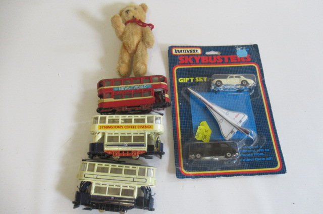 Three playworn trams fitted with Tenshodo motors Image