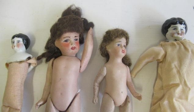 Four antique dolls Image