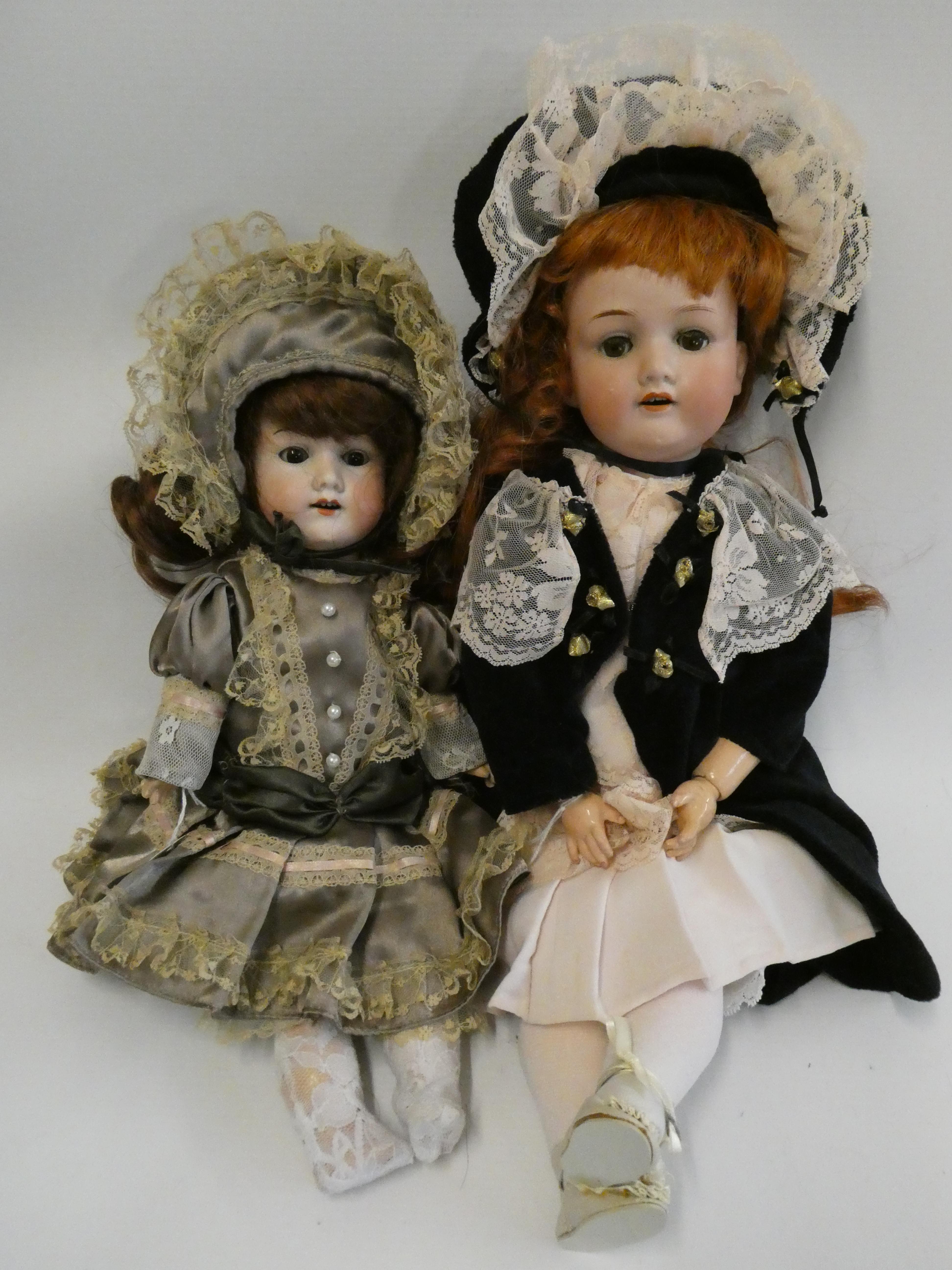 Two Armand Marseille bisque socket head dolls Image