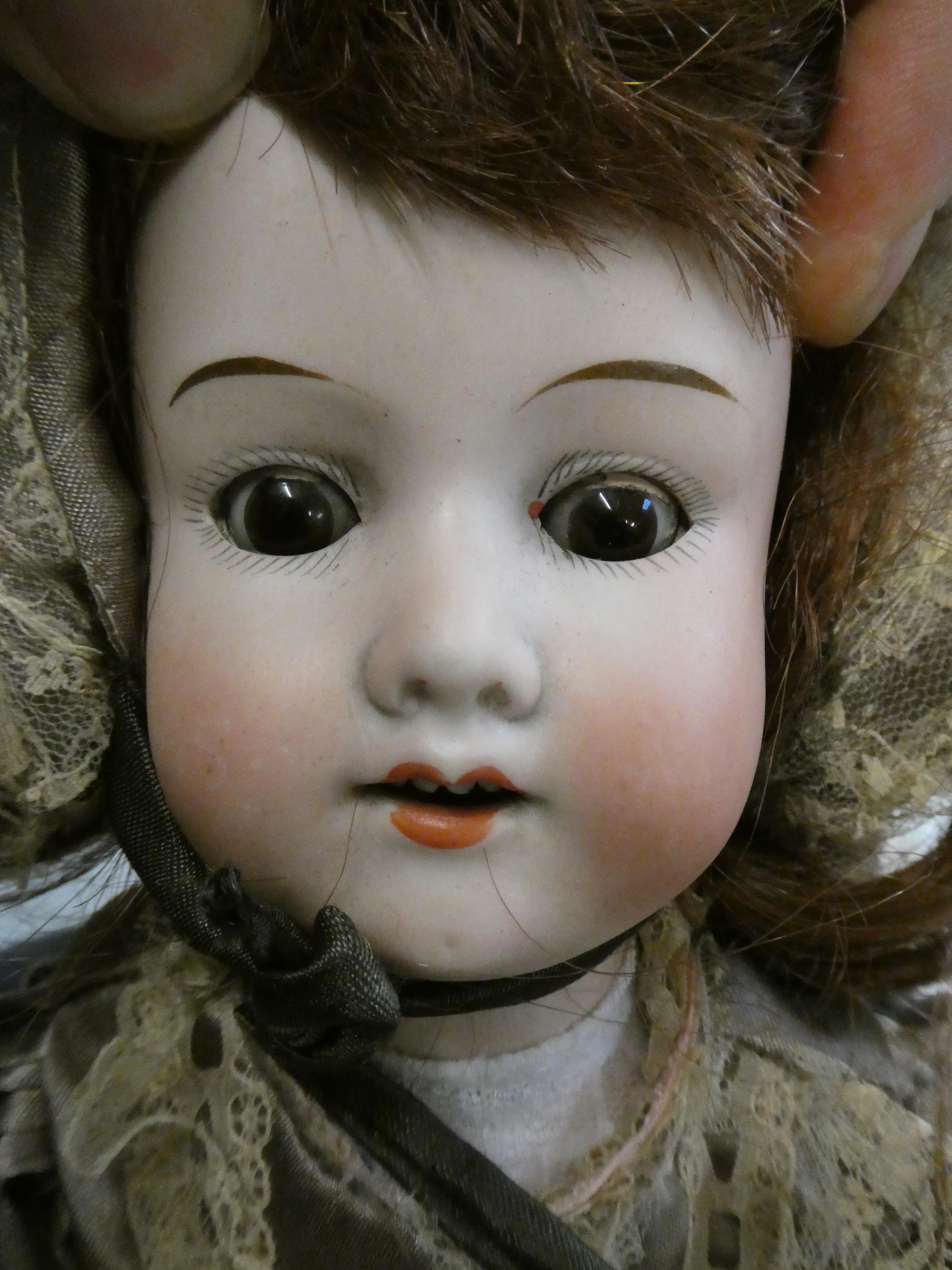 Two Armand Marseille bisque socket head dolls Image