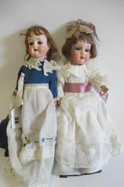 Two small bisque socket head dolls Image
