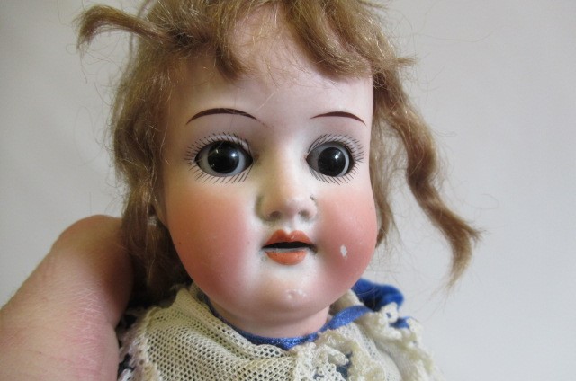 Two small bisque socket head dolls Image