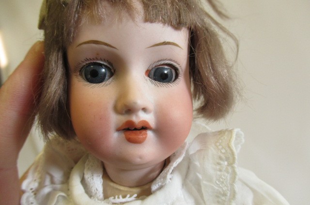 Two small bisque socket head dolls Image