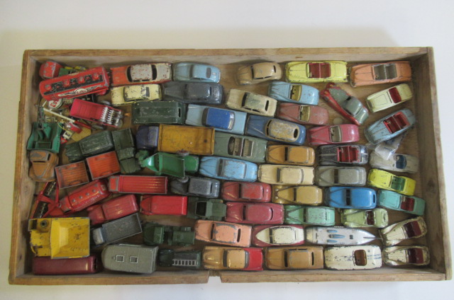 A large quantity of playworn Dinky vehicles including cars Image