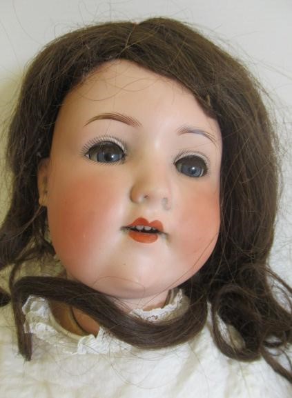 Two bisque socket head dolls Image