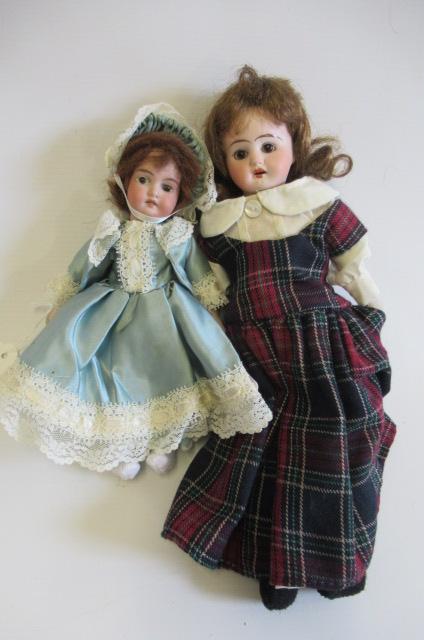 Two small bisque head dolls Image