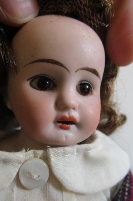 Two small bisque head dolls Image