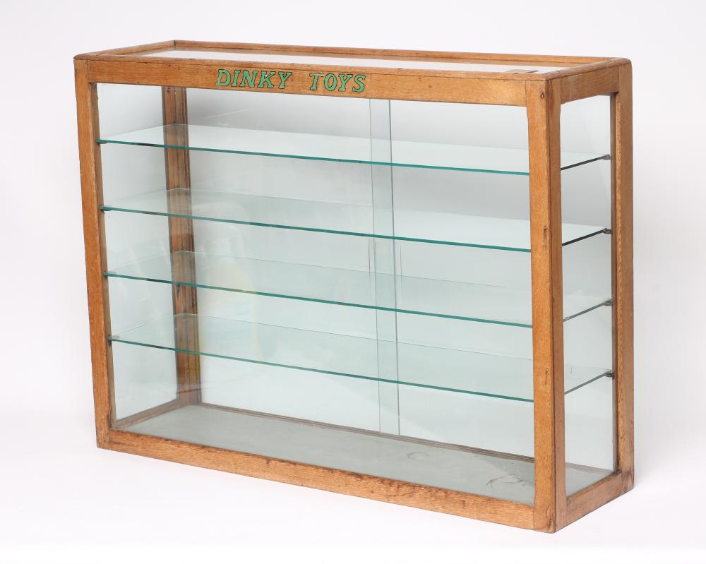 A glass toy shop display cabinet Image