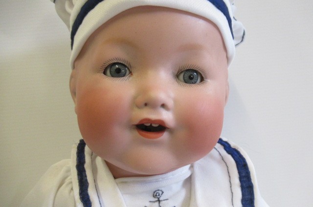 An Armand Marseille bisque socket head character boy doll Image