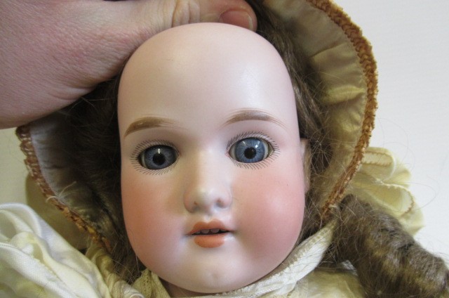 A Florodora Armand Marseille bisque shoulder head doll Image