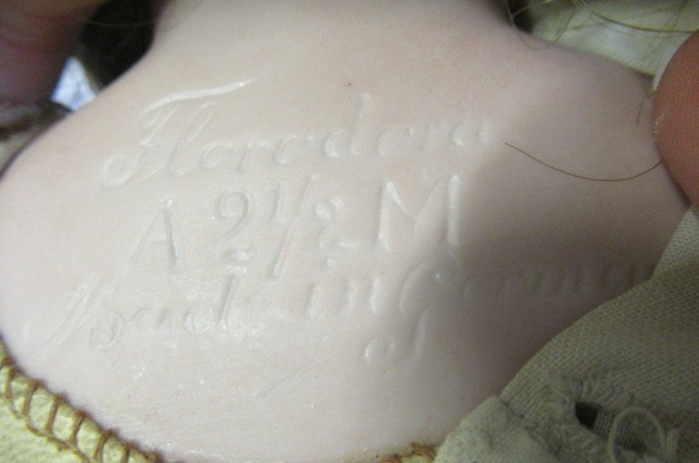 A Florodora Armand Marseille bisque shoulder head doll Image