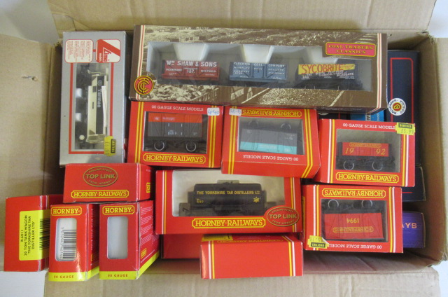 Boxed goods rolling stock by Hornby and others including tank wagons Image