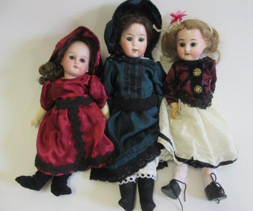 Three bisque head dolls Image