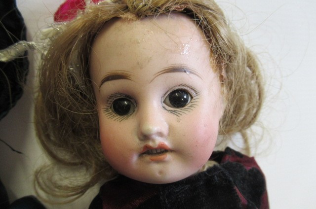 Three bisque head dolls Image