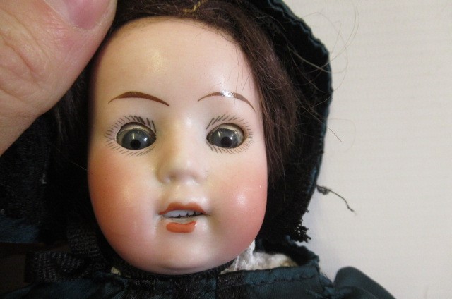 Three bisque head dolls Image