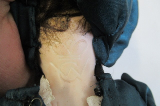 Three bisque head dolls Image