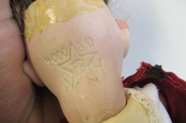 Three bisque head dolls Image