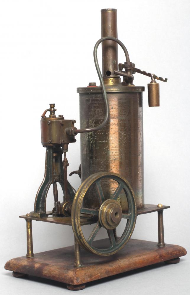 A table mounted vertical single cylinder steam engine with non-reversing slide valve cylinder to fly Image