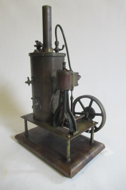 A table mounted vertical single cylinder steam engine with non-reversing slide valve cylinder to fly Image