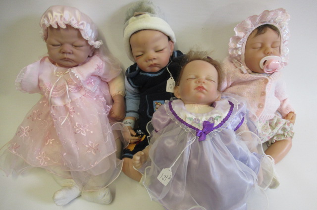 Four Ashton Drake dolls Image