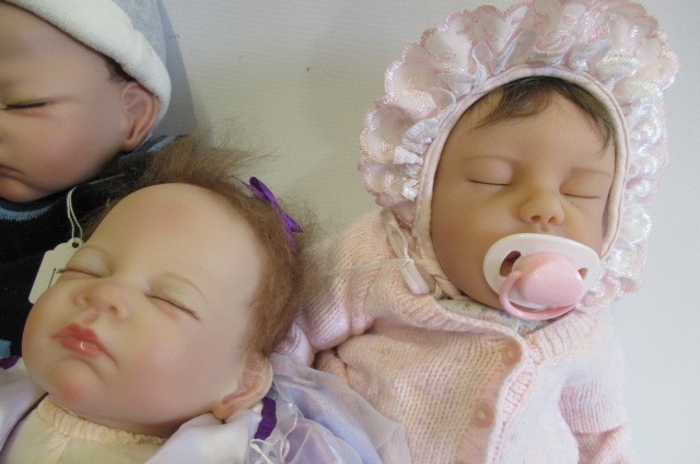 Four Ashton Drake dolls Image