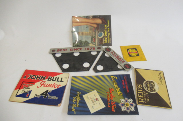 Seven small advertising signs in cardboard and tin Image