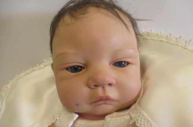 Four Ashton Drake dolls Image