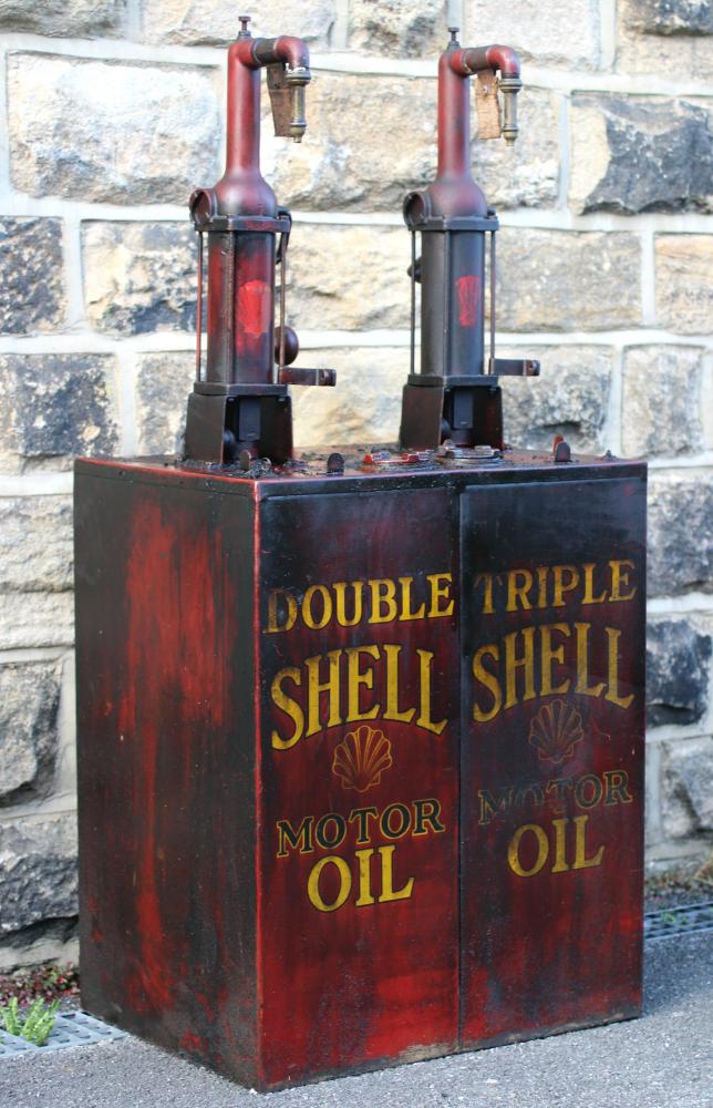 A floor standing garage oil dispenser pump finished in red with two pumps Image