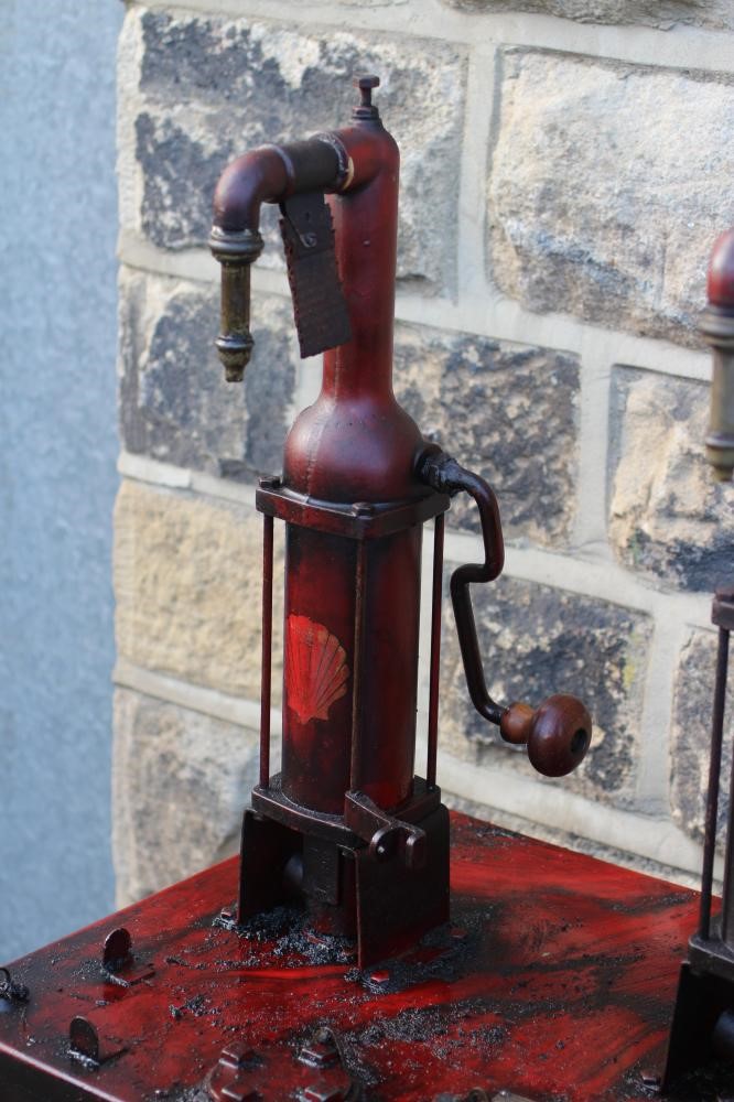 A floor standing garage oil dispenser pump finished in red with two pumps Image