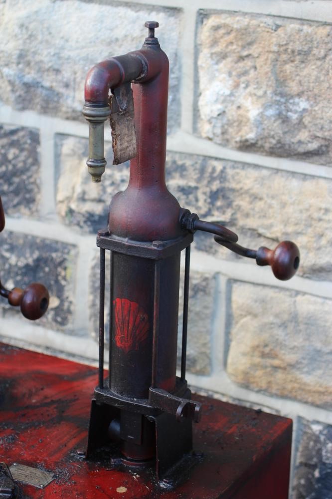 A floor standing garage oil dispenser pump finished in red with two pumps Image