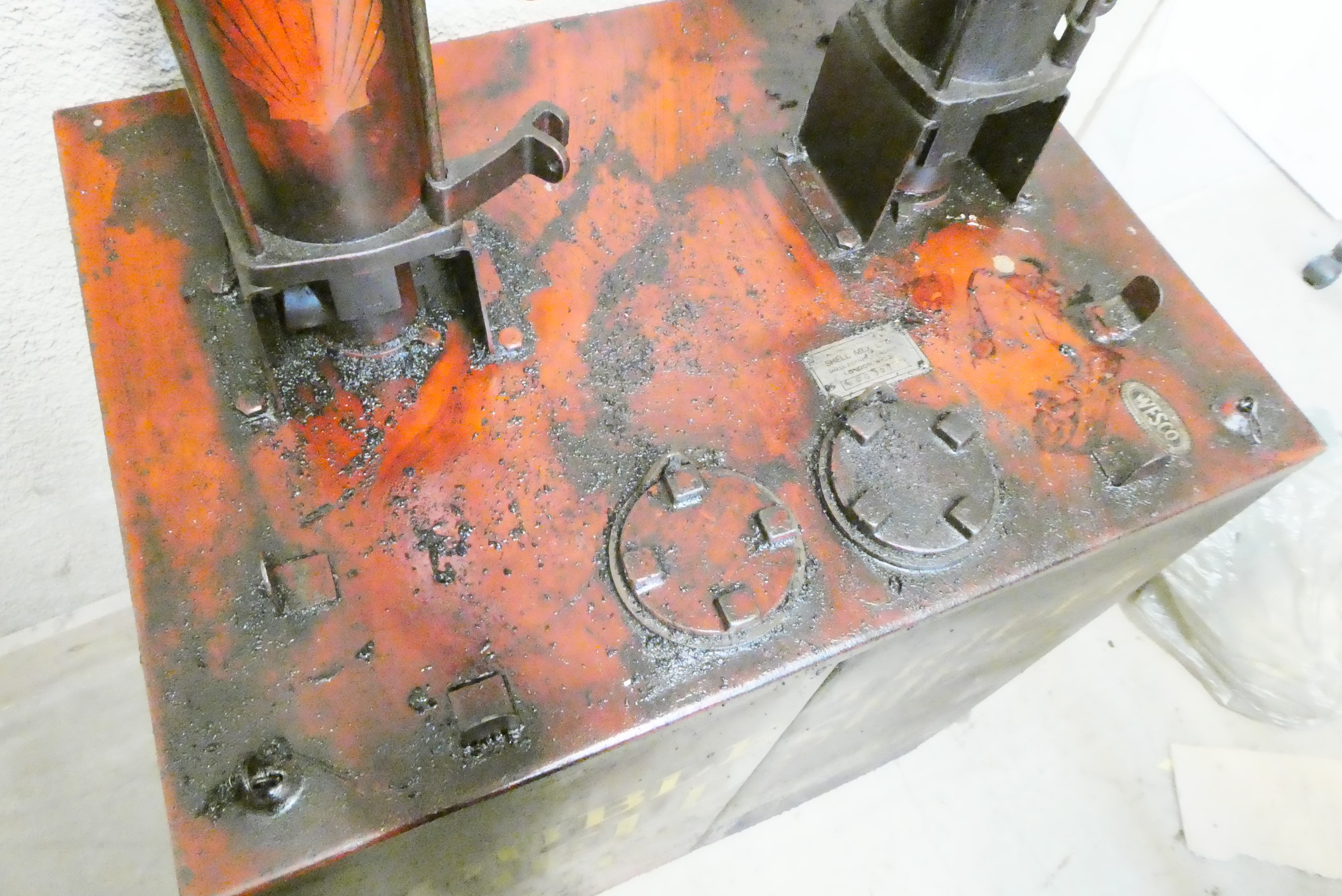 A floor standing garage oil dispenser pump finished in red with two pumps Image