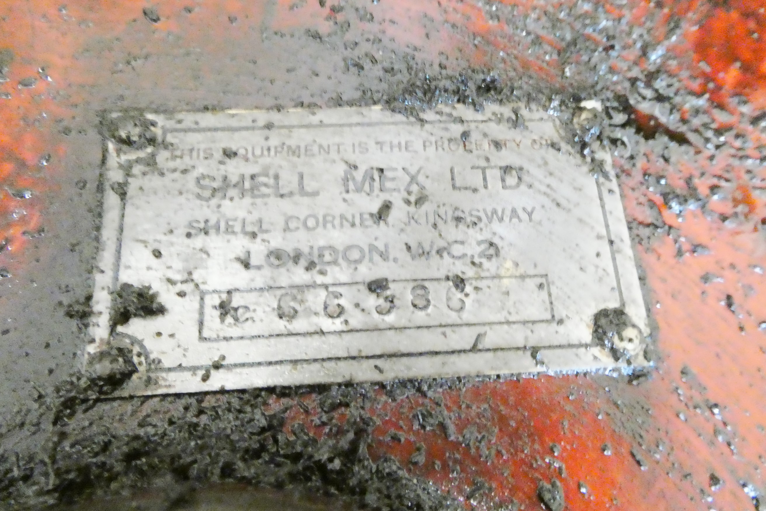 A floor standing garage oil dispenser pump finished in red with two pumps Image