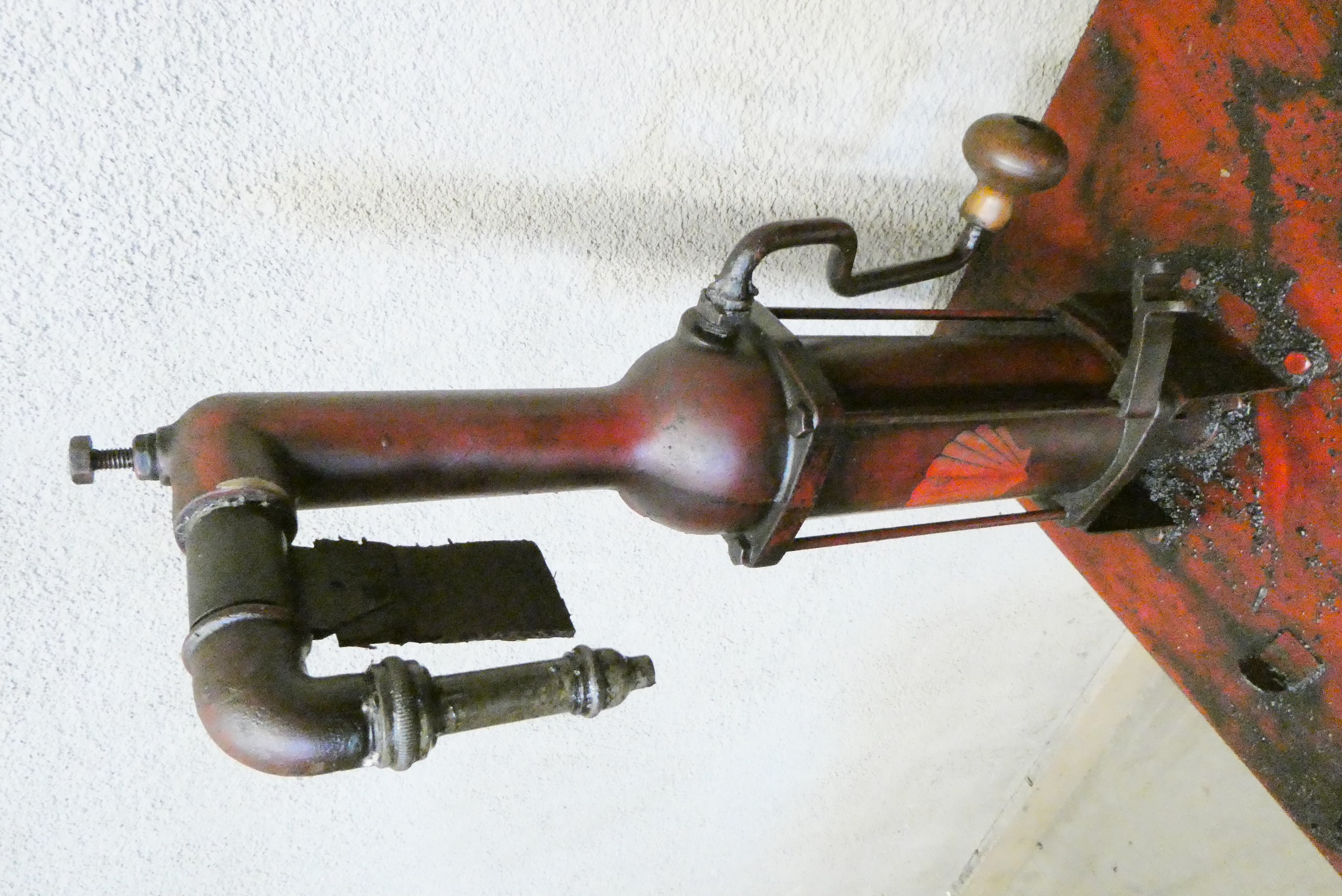 A floor standing garage oil dispenser pump finished in red with two pumps Image