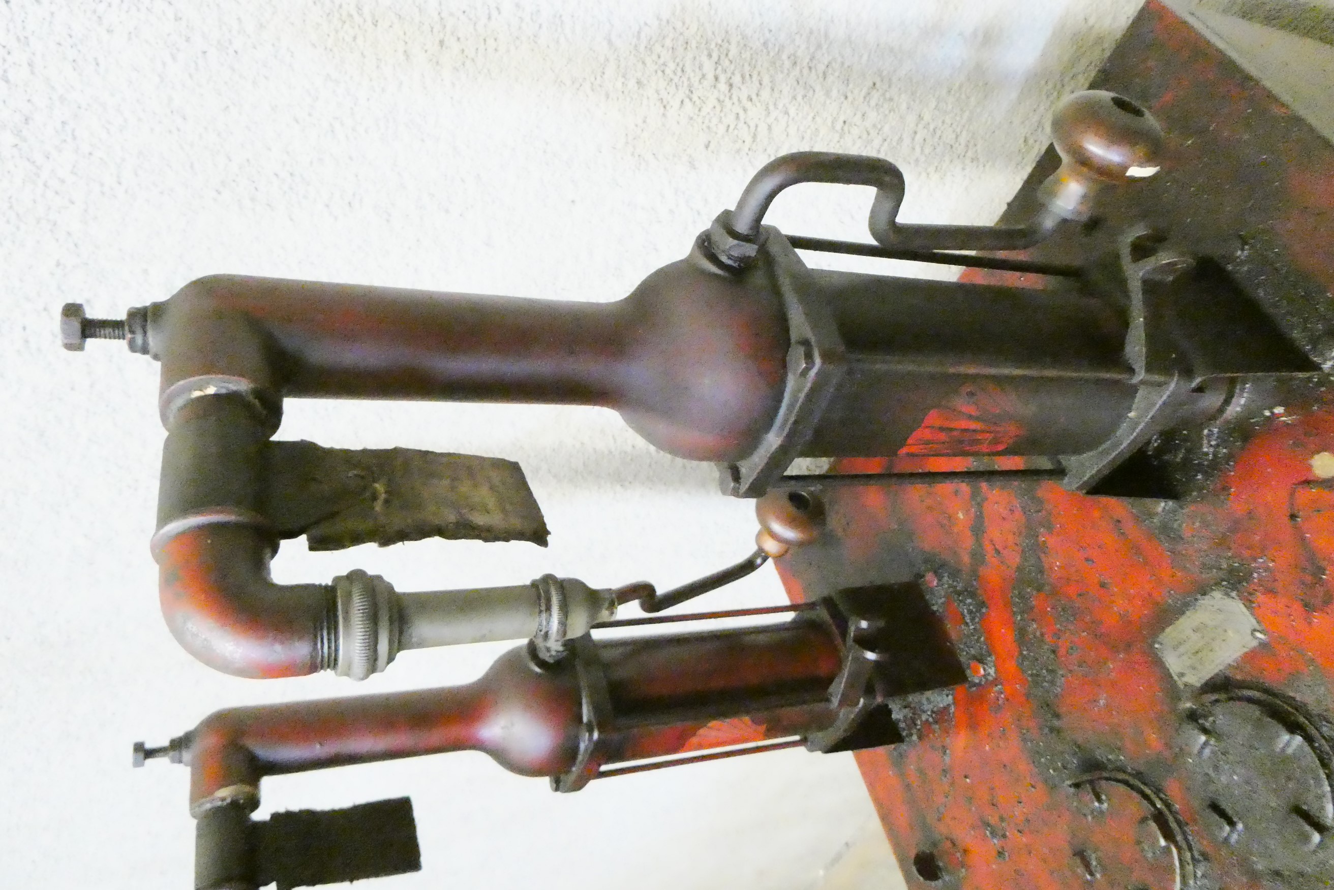 A floor standing garage oil dispenser pump finished in red with two pumps Image