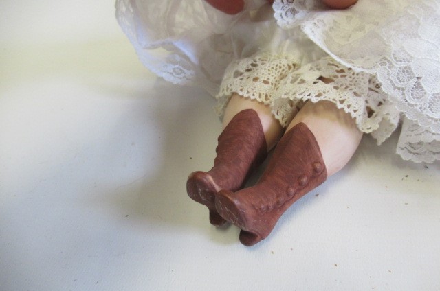 Three reproduction dolls Image
