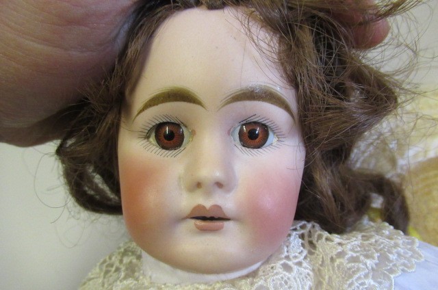 Three reproduction dolls Image