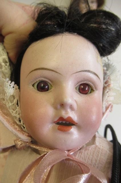 Three reproduction dolls Image