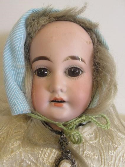 A Cuno & Otto Dressel bisque shoulder head doll Image