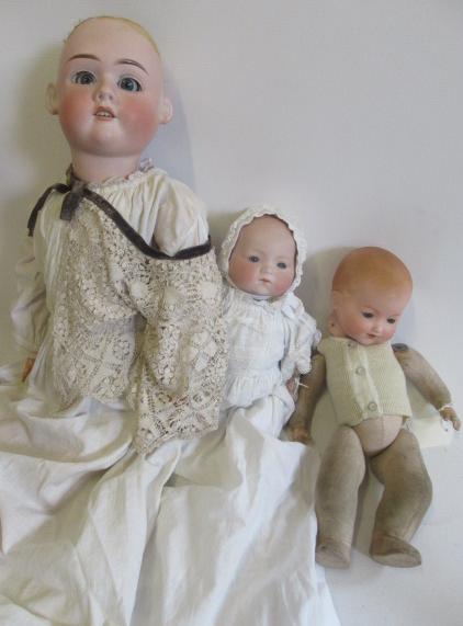 Three bisque head dolls Image