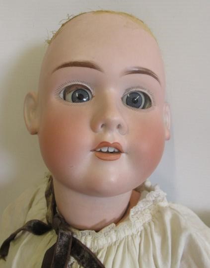 Three bisque head dolls Image