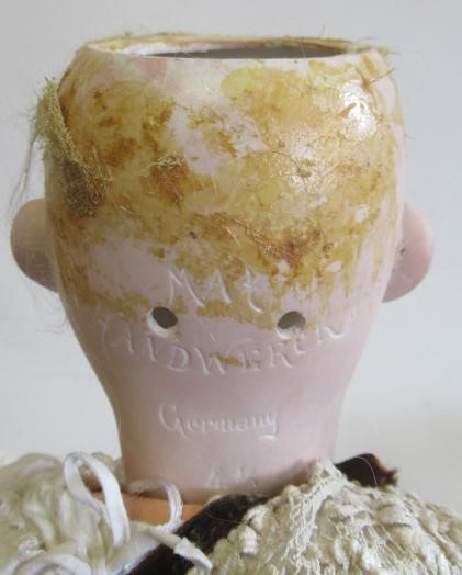 Three bisque head dolls Image