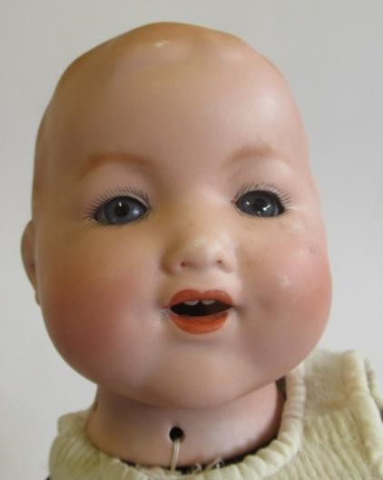 Three bisque head dolls Image