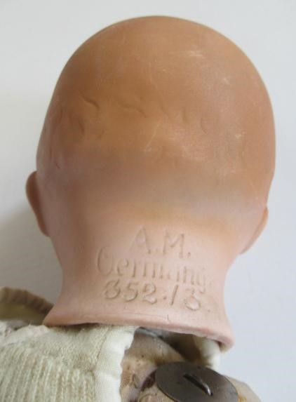 Three bisque head dolls Image