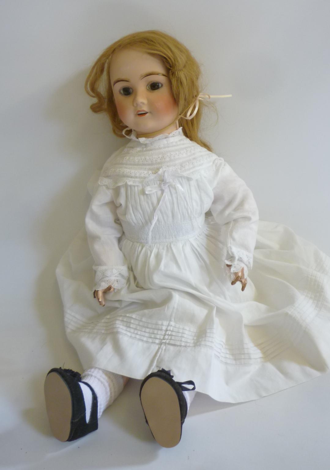 An A. Lanternier & Cie bisque head doll with fixed brown glass eyes Image