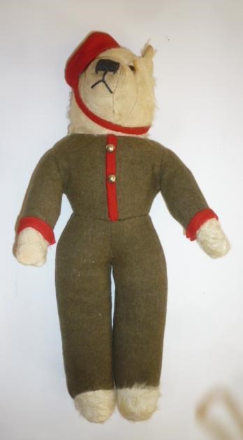 A Bell Hop teddy bear with cream plush head and paws Image