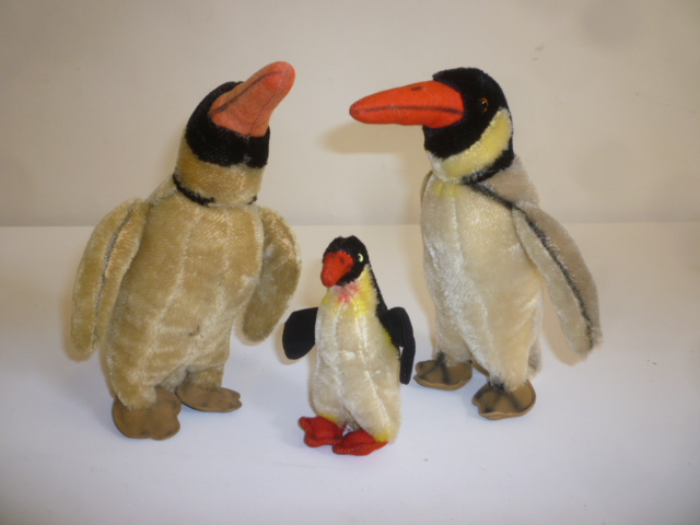 A family of three penguins Image